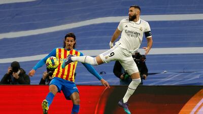 Real Madrid striker Karim Benzema in action against Valencia's Edinson Cavani. EPA