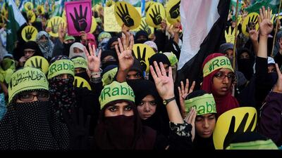 Activists of Jamaat e Islami Pakistan take part in an Egypt and Syrian solidarity march in Karachi, Pakistan. Asif Hassan / AFP