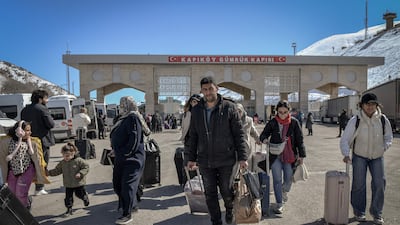 Iranian citizens arrive in Turkey after passing through the Razi-Kapikoy border crossing in Van. AFP