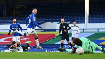 Everton's Bernard (2L) watches as his shot hits the post during extra-time. AFP