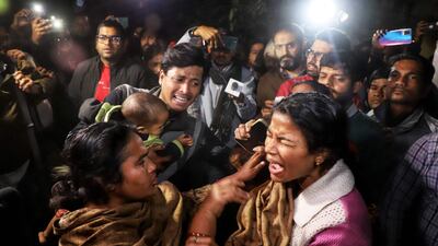 Local residents at the scene after the accident. AFP