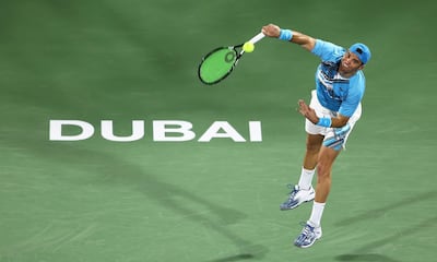 Malek Jaziri serves against Jo-Wilfried Tsonga at the Dubai Duty Free. Getty