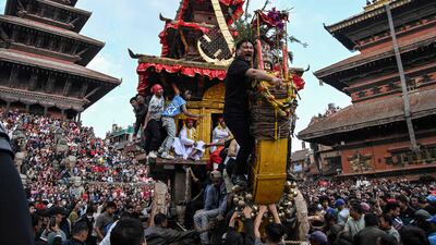 Devotees pull a wooden chariot carrying an idol of the Hindu deity Bhairav during the Bisket Jatra festival marking the Nepali New Year in Bhaktapur on the outskirts of Kathmandu. AFP