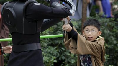 A young guest participates in the revamped Jedi Training: Trials of the Temple attraction during the Star Wars Launch Bay grand opening at Disney’s Hollywood Studios in Orlando, Florida. Scott Audette / Reuters