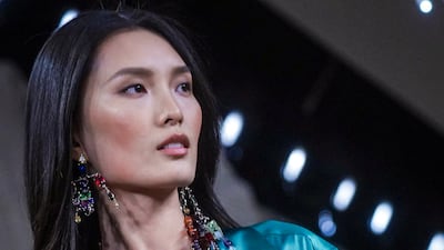 Beading was used throughout, often paired with flowing satin fabrics. AP