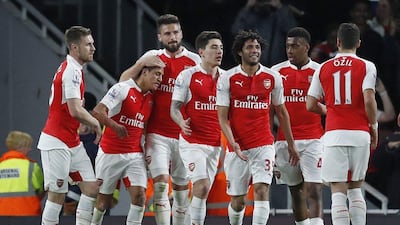 Arsenal’s Alexis Sanchez celebrates scoring the second goal with teammates. Eddie Keogh / Reuters