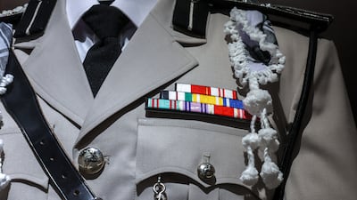 A close-up of the Abu Dhabi Defence Force officer's uniform