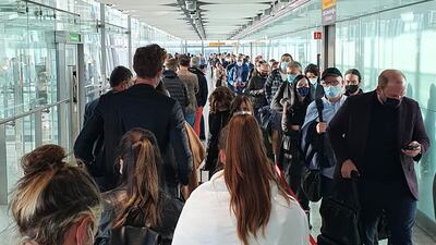 Passengers queue for the Arrival Hall at London Heathrow Airport's Terminal 5, due to a problem with the self-service passport gates.