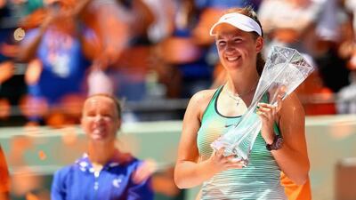 Victoria Azarenka poses with the Miami Open trophy after defeating Svetlana Kuznetsova in the final. Clive Brunskill / Getty Images