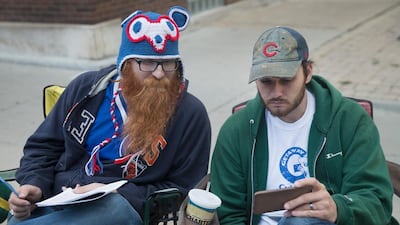 Dude, has anyone bid on my hat collection? I’m stressing out here. Scott Olson / Getty Images / AFP