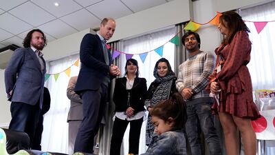 Britain's Prince William meets people evacuated from Afghanistan, who are now living in a hotel in Leeds. Reuters