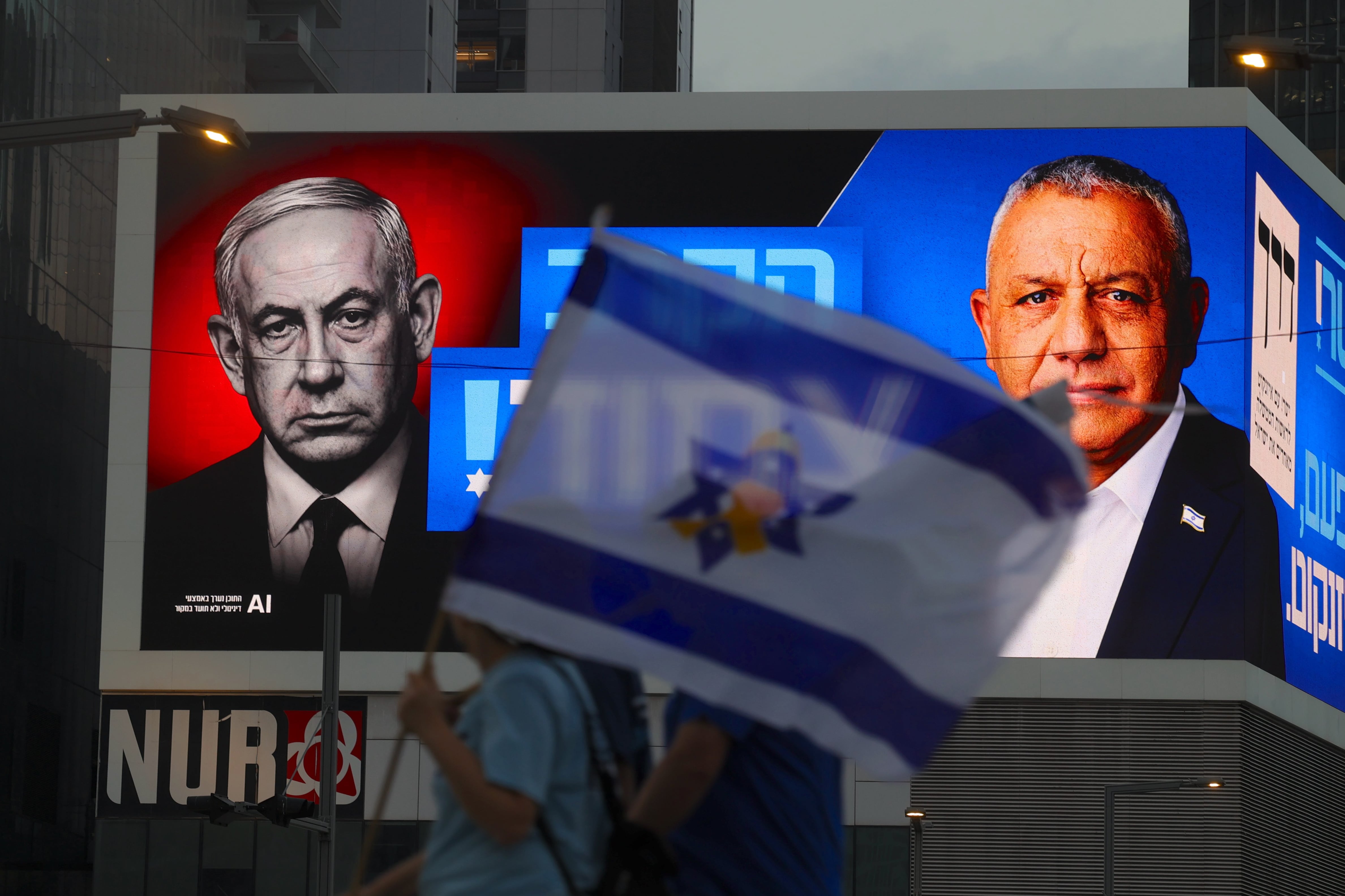 Israeli Prime Minister Benjamin Netanyahu, left, faces a stiff challenge from former general Gadi Eisenkot in Tuesday's election. EPA