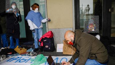 Students hold an outdoor lesson in protest against the anti-coronavirus measures, in Turin, Italy. EPA