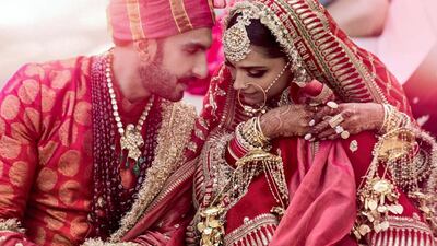 Singh matched Padukone's traditional red-and-gold bridal look in this kurta and turban. Twitter / Deepika Padukone