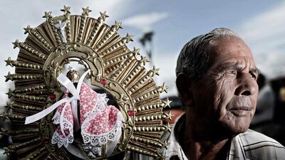 A devotee of the Virgen de Los Angeles, Costa Rica’s patron saint, takes part in a pilgrimage in Cartago, about 20km from the capital San Jose. Jeffrey Arguedas / EPA