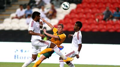Mark Milligan strikes at goal durng the international friendly between the UAE and Australia at Mohamed Bin Zayed Stadium on October 10, 2014 in Abu Dhabi, United Arab Emirates. Warren Little/Getty Images