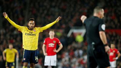 Arsenal's Pierre-Emerick Aubameyang reacts after referee awards the goal after a VAR review. Reuters