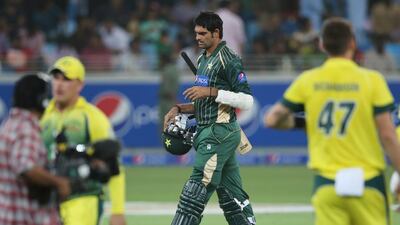 Pakistani batsman Mohammad Irfan walks off the pitch after he was dismissed during the second one day international match between Australia and Pakistan in Dubai, United Arab Emirates, Friday, Oct. 10, 2014. AP Photo/Kamran Jebreili