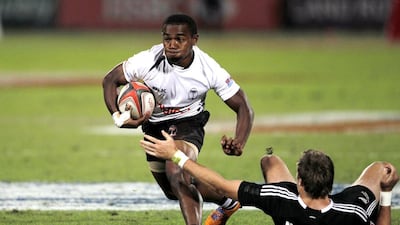There was no stopping Waisea Nacuqu, left, and Fiji on Saturday as they routed New Zealand 44-0 then dispatched South Africa 29-17 to win their first Dubai Rugby Sevens title. Nikhil Monteiro / Reuters