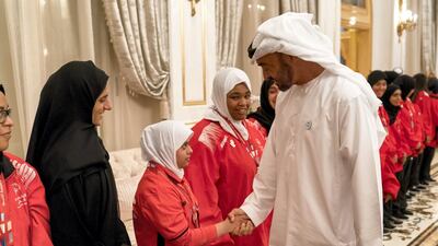 Sheikh Mohammed bin Zayed, Crown Prince of Abu Dhabi and Deputy Supreme Commander of the UAE Armed Forces (R), receives members of the UAE Special Olympics team, during a Sea Palace barza. Rashed Al Mansoori / Crown Prince Court - Abu Dhabi