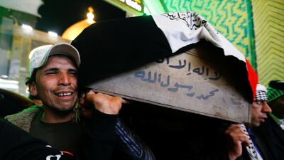 Mourners carry the coffin of a man, who was killed in a twin suicide bombing attack in a central Baghdad market, during a funeral in Najaf, Iraq. REUTERS