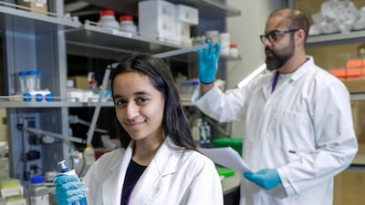 Alia Al Mansoori is being tutored by Research Assistant Professor, Mohamed Al Sayegh, right, at New York University Abu Dhabi. Victor Besa/The National.