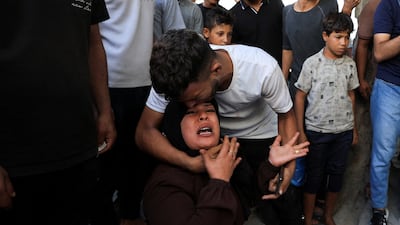 People mourn Palestinians who were killed in an Israeli air strike in Gaza City on October 10, 2026. Reuters