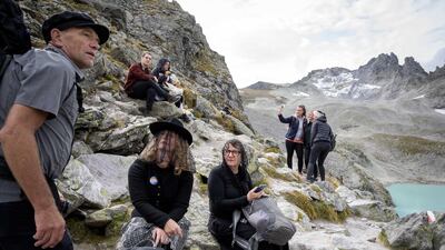 People take part in a ceremony to mark the 'death' of the Pizol glacier (Pizolgletscher) above Mels, eastern Switzerland.AFP