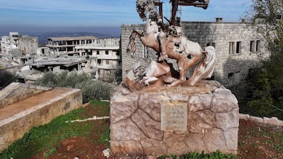 Destroyed statue of Saint George and the Dragon in Al-Ghassaniya, a mainly Christian town in central Syria, as residents who fled during the civil war begin to return. AFP