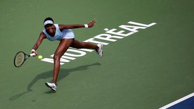 Venus Williams returns a shot to Serena Williams during the women’s semifinals match in the Rogers Cup at Uniprix Stadium on August 9, 2014 in Montreal, Canada. Streeter Lecka/Getty Images
