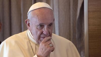 Pope Francis talks with journalists aboard the flight from Italy to United Arab Emirates. EPA