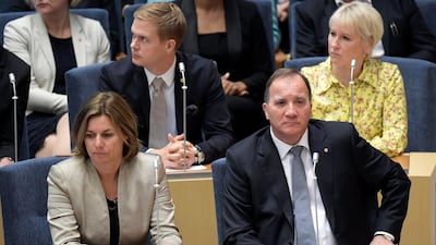 Swedish Prime Minister Stefan Lofven, right, attends parliament during a vote of confidence in September in the Swedish Parliament Riksdagen. AP