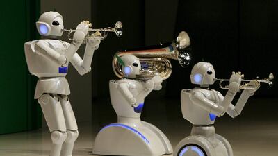 Toyota Motor Corporations’s partner robots play instruments at the company’s showroom in Tokyo. Toru Hanai / Reuters