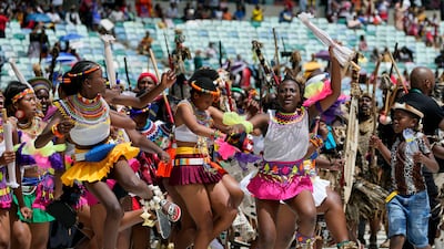 Zulu women sing and dance as they arrive for King Misuzulu's coronation at the Moses Mabhida Stadium in Durban, South Africa. AP