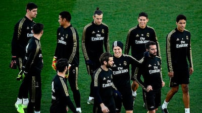 Real Madrid's players, including Gareth Bale, back row centre, during a public training session. AFP