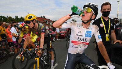 UAE Team Emirates rider Tadej Pogacar takes a drink after the stage. AP