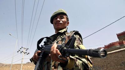 An Afghan soldier stands guard as part of heightened security following the news that Mullah Omar was dead. Jawad Jalali / EPA
