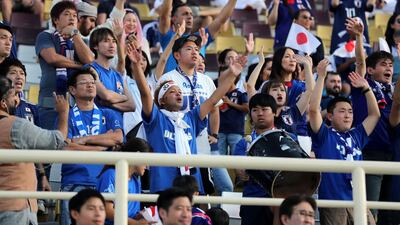 Japan's fans celebrate their win over Turkmenistan. All images by Chris Whiteoak/The National