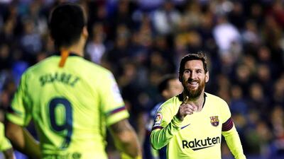 Lionel Messi celebrates with his teammate Luis Suarez. EPA