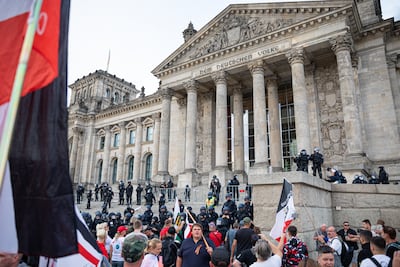 The black, white and red imperial German flag is flown in front of parliament during a coronavirus protest in 2020. Getty