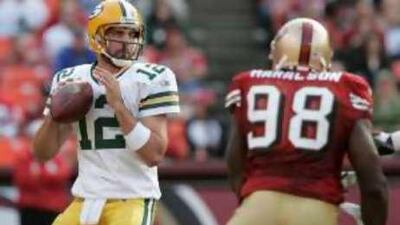 The Green Bay Packers quarterback Aaron Rodgers prepares to make a pass during a preseason game against San Francisco.