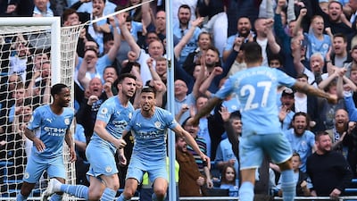 City's Aymeric Laporte, second left, celebrates after scoring their second goal. EPA