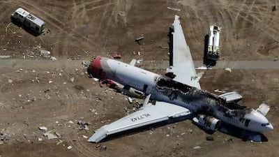 The Asiana Airlines Boeing 777 plane lies burned near the runway after crash-landing at San Francisco International Airport.