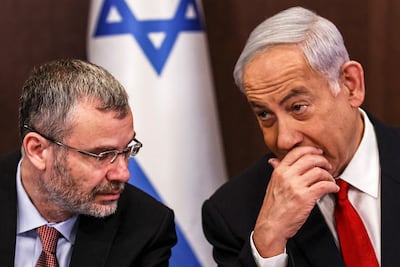 Israeli Prime Minister Benjamin Netanyahu, right, speaks with Justice Minister Yariv Levin. AFP