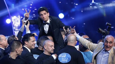 Palestinian singer Mohammed Assaf celebrates winning Arab Idol in 2013. Mohammed Azakir / Reuters