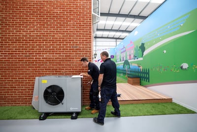 Engineers install an Ecoforest heat pump at Octopus Energy's training and research centre in Slough, the UK, on September 28. Photo: Bloomberg