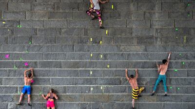 Participants climb up a pier wall on the Danube during the ‘Urban Waters Cup 2016’ competition in Vienna. Christian Bruna / EPA