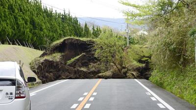 A national motorway is blocked by landslide caused by an earthquake in Minamiaso, Kumamoto prefecture, southern Japan. Powerful earthquakes a day apart shook southwestern Japan, trapping many beneath flattened homes and sending thousands to seek shelter in gymnasiums and hotel lobbies. Hiroko Harima / Kyodo News via AP