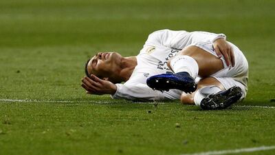 Cristiano Ronaldo goes down holding his hamstring after sustaining an injury during Real Madrid's win over Villarreal. Juan Medina / Reuters