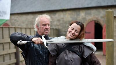 Lead Game of Thrones tour instructor William Kells prepares to ‘behead’ a tourist as part of the Winterfell experience at Castle Ward. Charles McQuillan / Getty Images